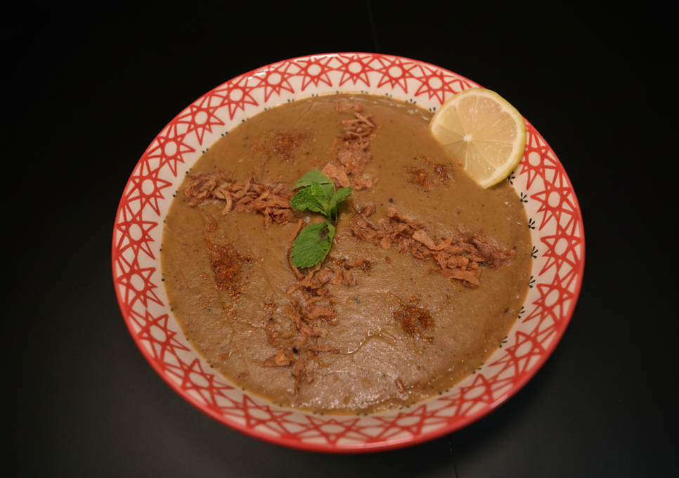 Beef Haleem served in traditional handi with garnish